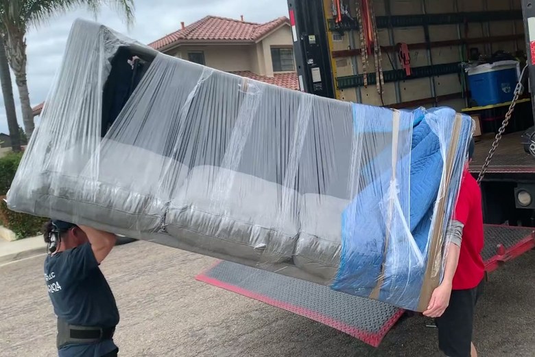 Loading a shrink-wrapped sofa